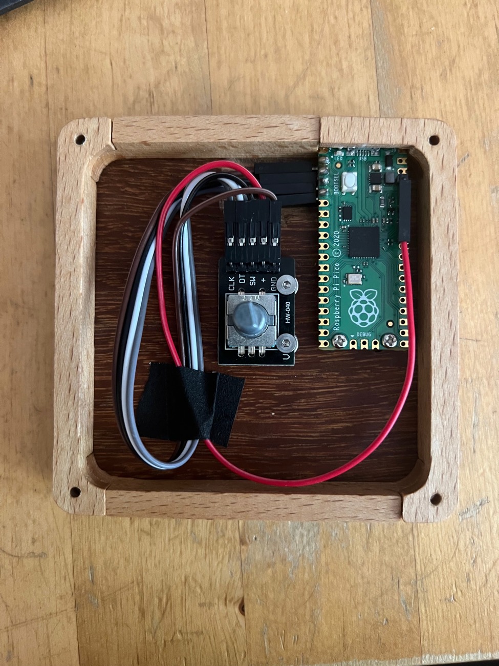 Open TrigOne Mini wooden enclosure with rotary encoder and Raspberry Pi Pico